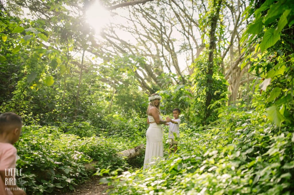 mom and sons exploring the forest in hawaii
