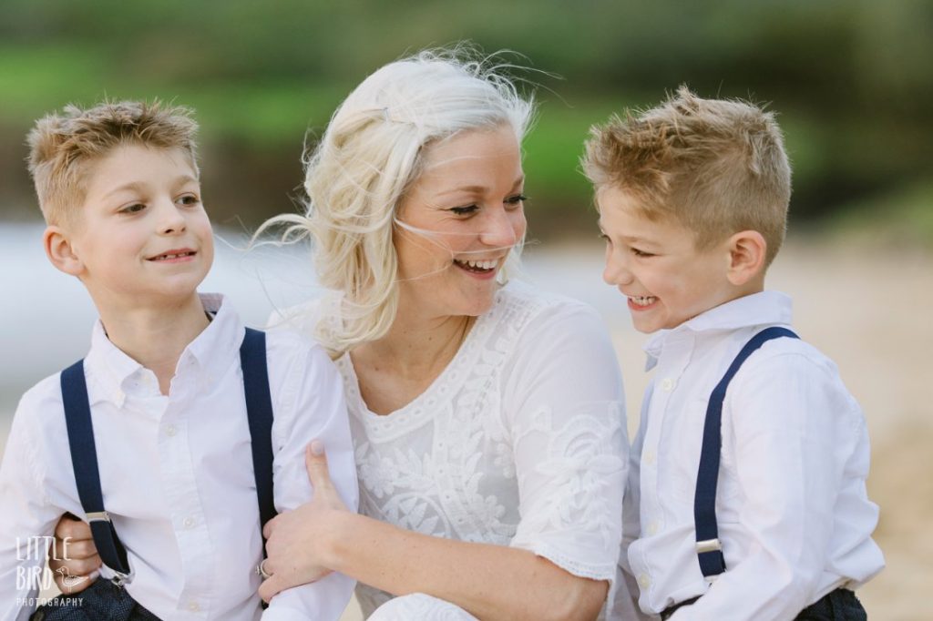 mom talking with sons after a vow renewal in hawaii