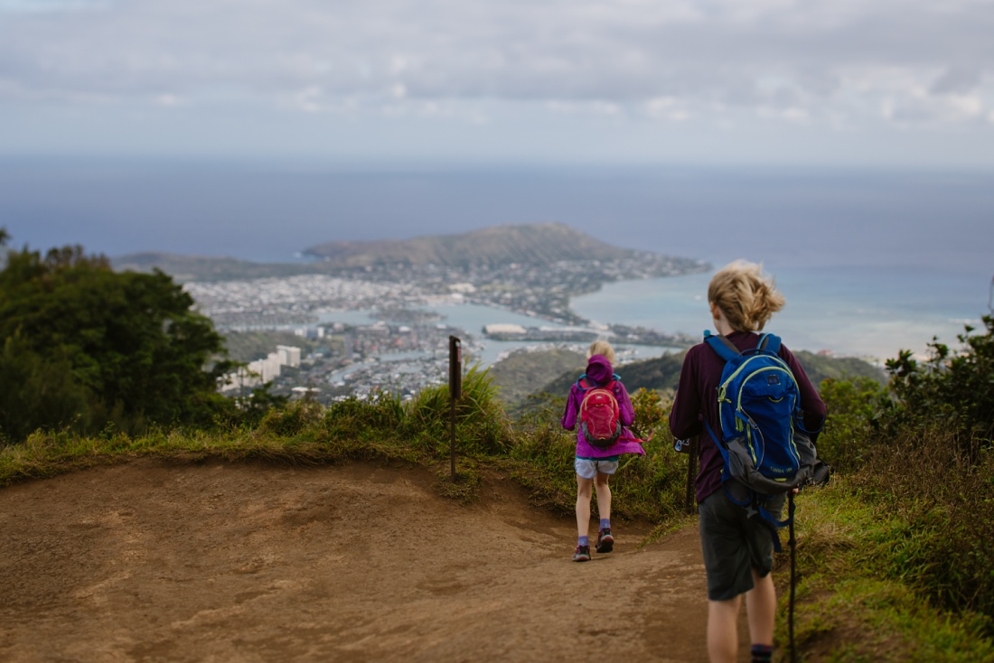 kids at the summit of the kuliouou hike looking over hawaii kai